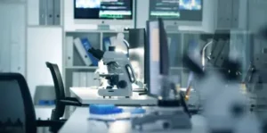 img-Industries-medical-device Engineer inspecting a medical device component in a clean lab