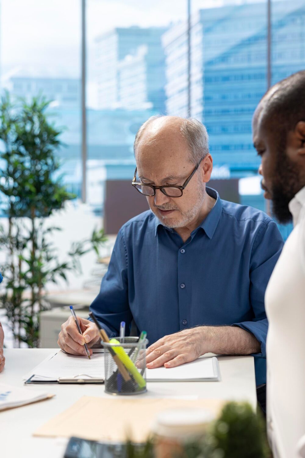two men reviewing audit paperwork